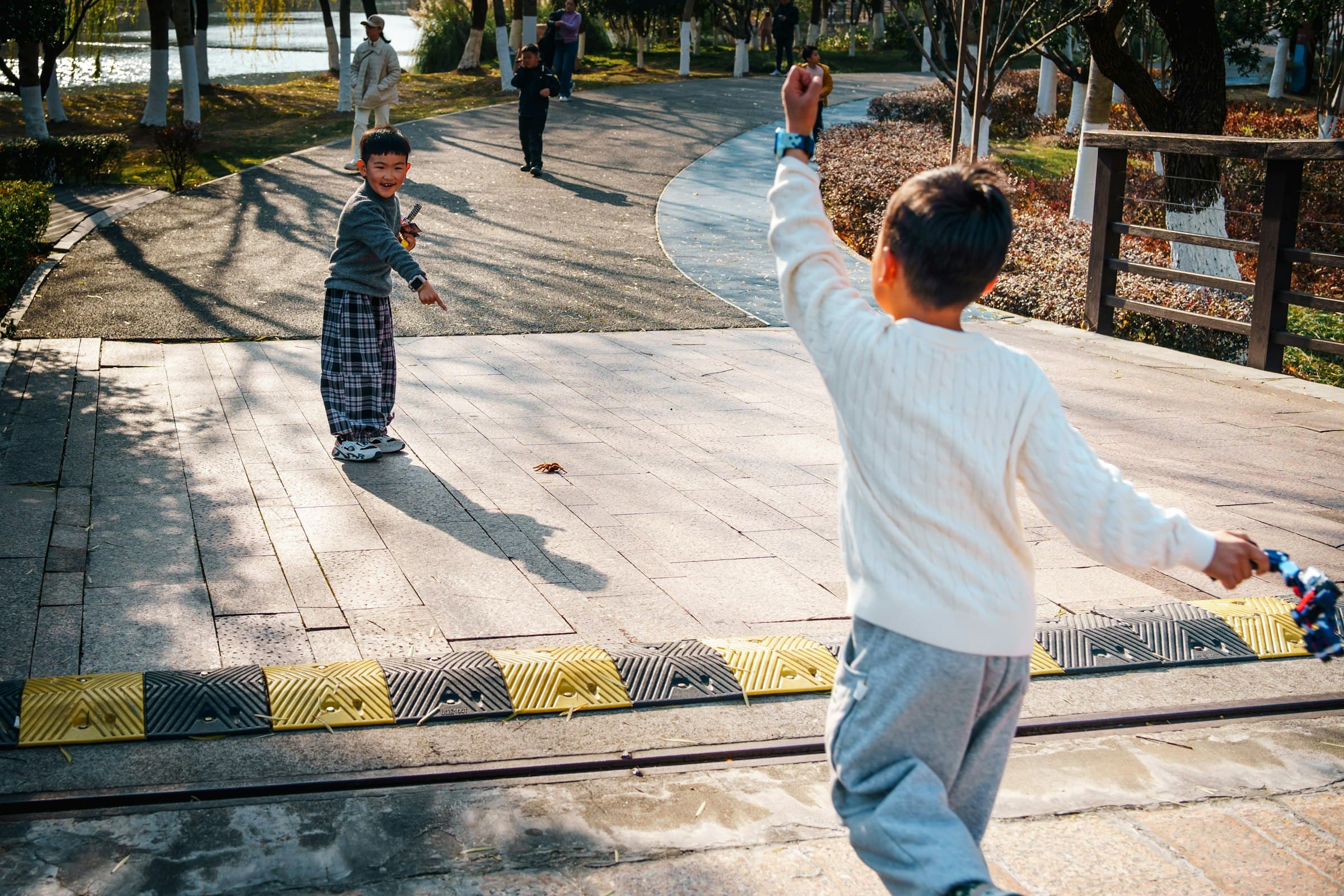 Two boys playing sport outdoors