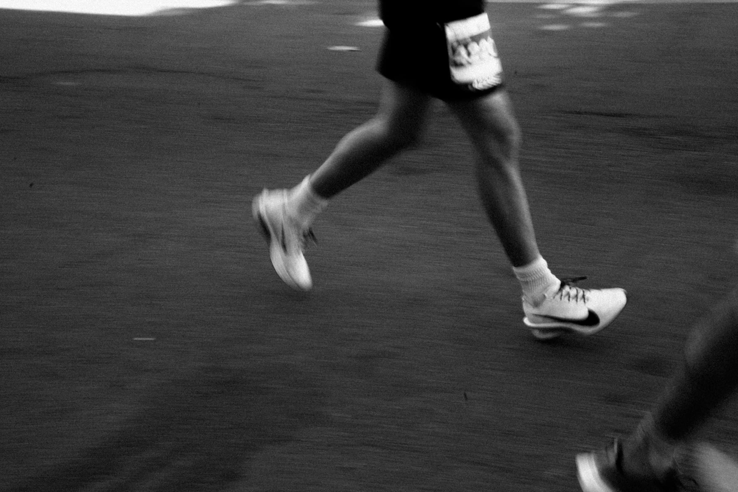 Runners mid-stride during a race